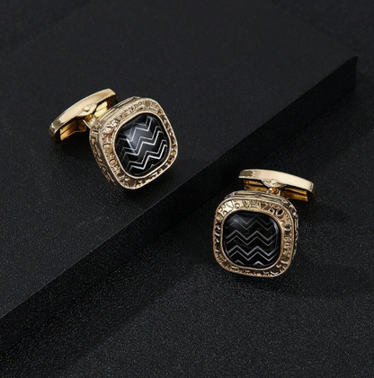 Herrmanschettknapp med gyllene bas och svart mönster